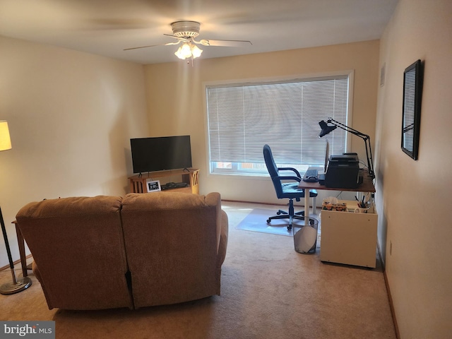 office space with carpet and ceiling fan