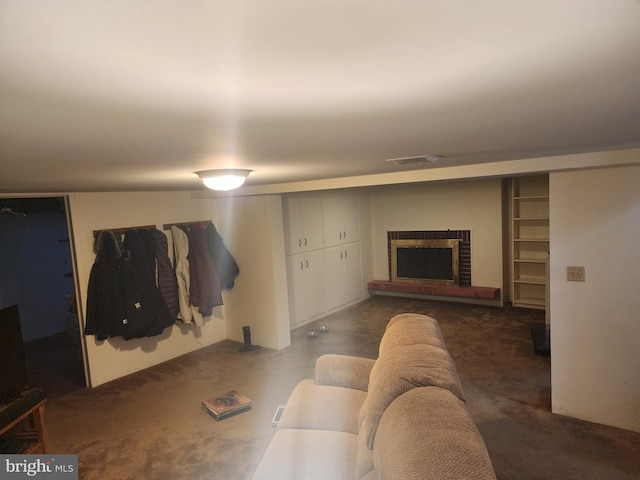 living area featuring a fireplace and visible vents