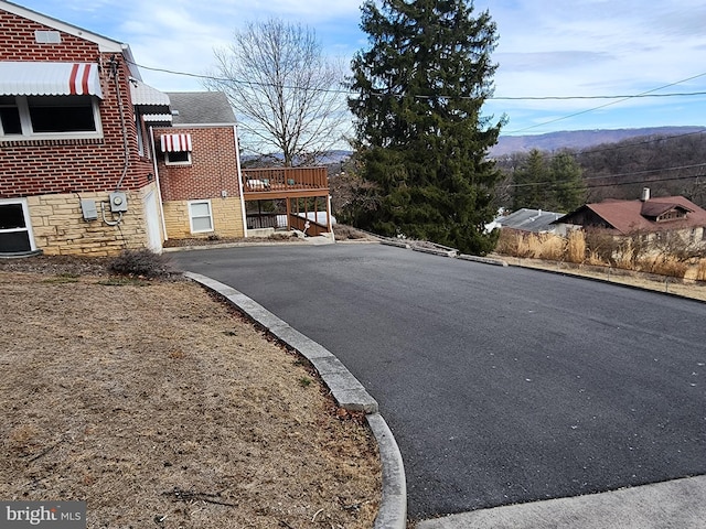 view of street featuring curbs