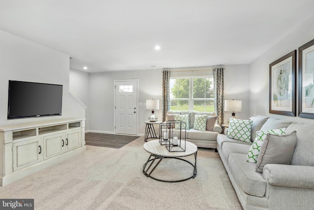 living room with carpet, baseboards, and recessed lighting