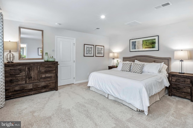 carpeted bedroom with baseboards and visible vents