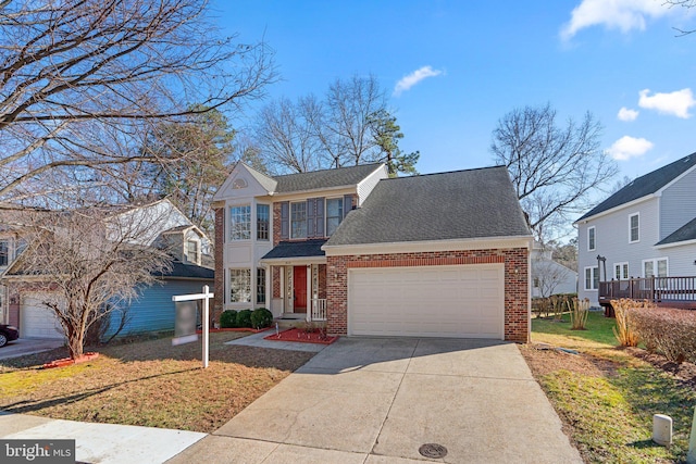 traditional home with brick siding, a front lawn, concrete driveway, roof with shingles, and an attached garage