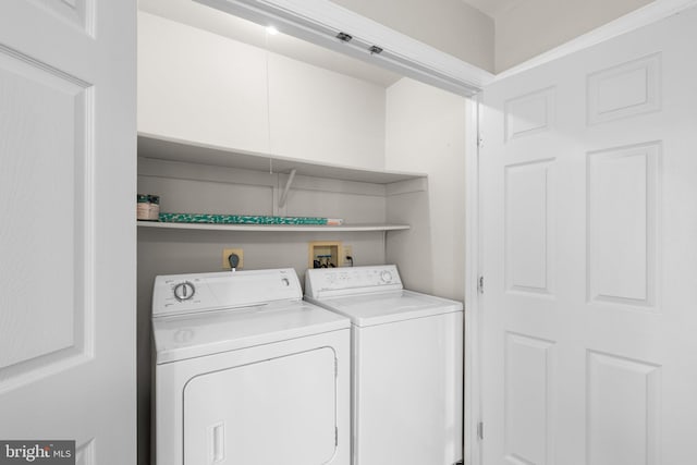 laundry area with laundry area and washing machine and clothes dryer