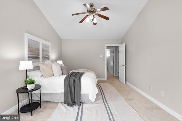 bedroom with baseboards, lofted ceiling, light carpet, and a ceiling fan