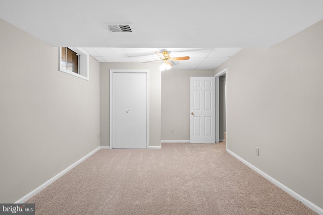 unfurnished bedroom with a ceiling fan, visible vents, carpet, baseboards, and a closet