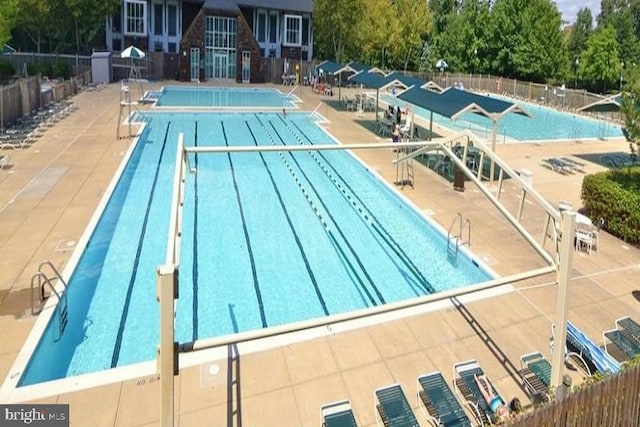 community pool featuring fence