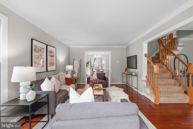 living area with crown molding, baseboards, stairway, wood finished floors, and a notable chandelier