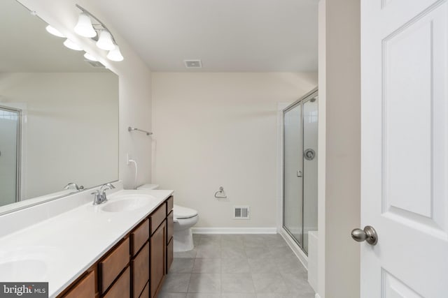 bathroom featuring tile patterned floors, visible vents, a sink, and tiled shower