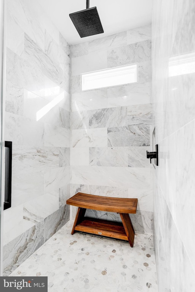 bathroom with tiled shower