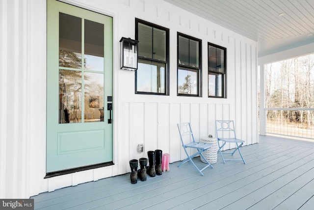 property entrance featuring board and batten siding