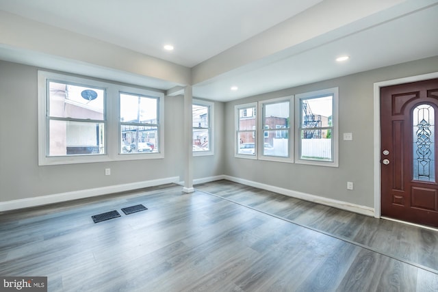 foyer entrance with recessed lighting, baseboards, and wood finished floors