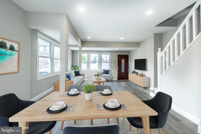 dining area with stairs, recessed lighting, wood finished floors, and baseboards