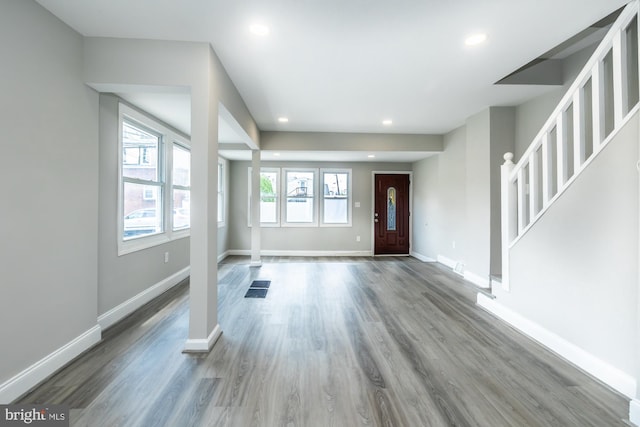 entrance foyer with recessed lighting, baseboards, and wood finished floors