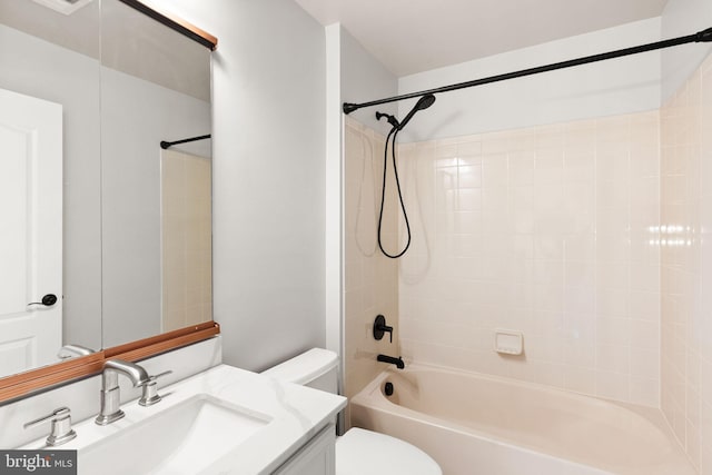 bathroom featuring toilet,  shower combination, and vanity