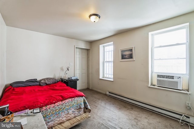 bedroom featuring carpet, a baseboard radiator, and cooling unit