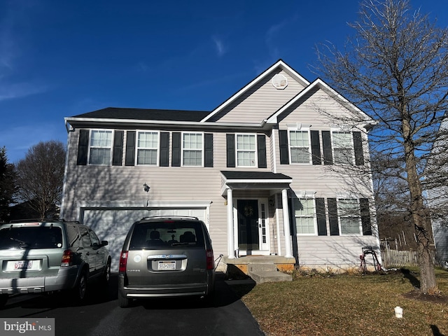 view of front facade featuring driveway and a garage