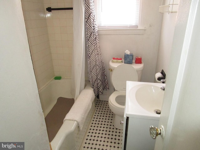 bathroom featuring toilet, tile patterned floors, shower / tub combo with curtain, and vanity