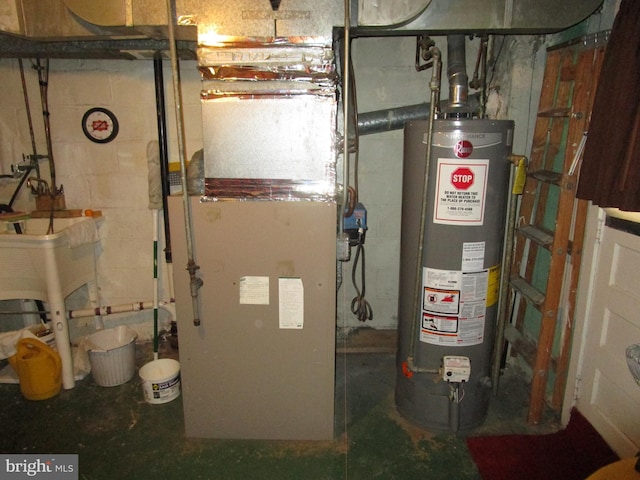 utility room featuring heating unit and gas water heater