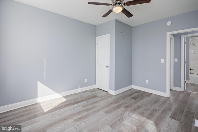 unfurnished bedroom featuring ceiling fan, wood finished floors, and baseboards