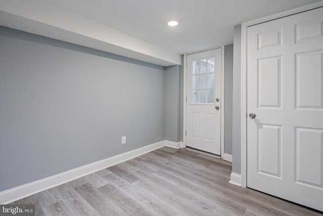 interior space with light wood-type flooring and baseboards