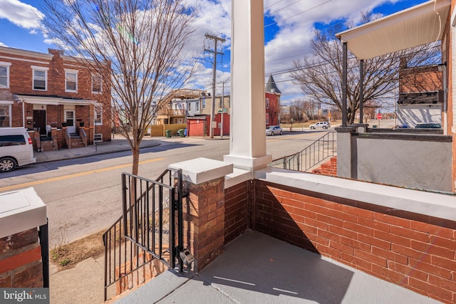 exterior space with a residential view and covered porch