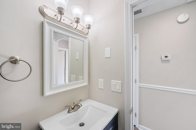 bathroom with visible vents and vanity