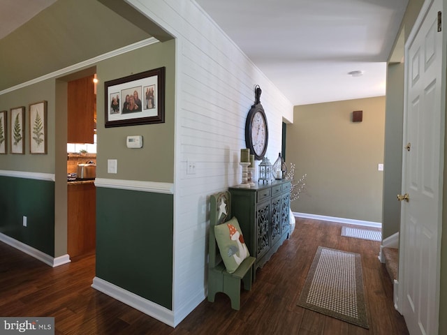 hall featuring dark wood finished floors and baseboards