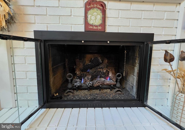 room details featuring tasteful backsplash and a fireplace