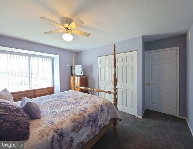 bedroom with baseboards, dark carpet, and ceiling fan