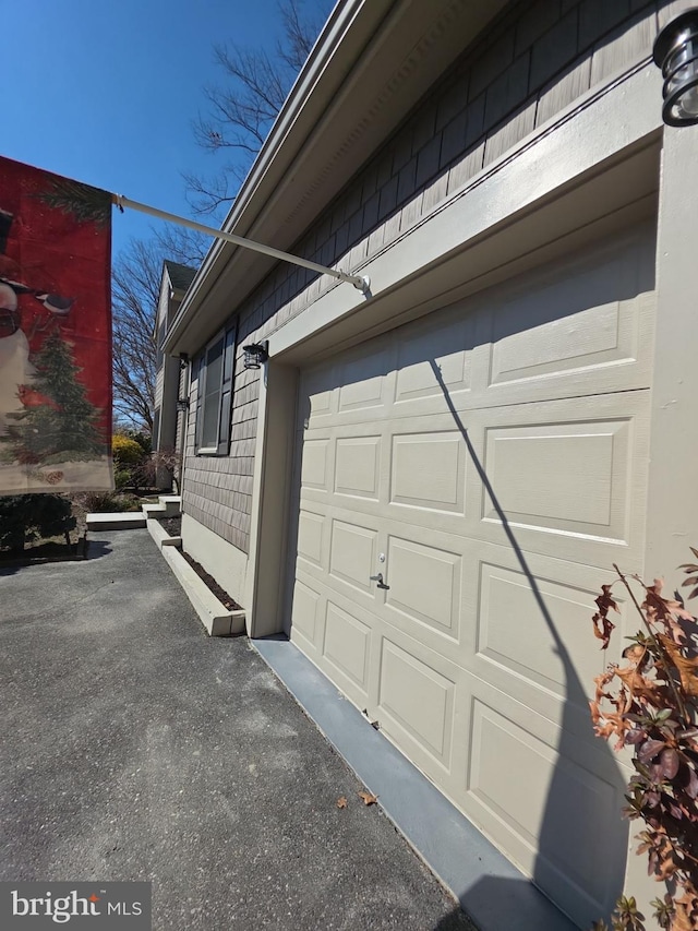 view of property exterior featuring a garage