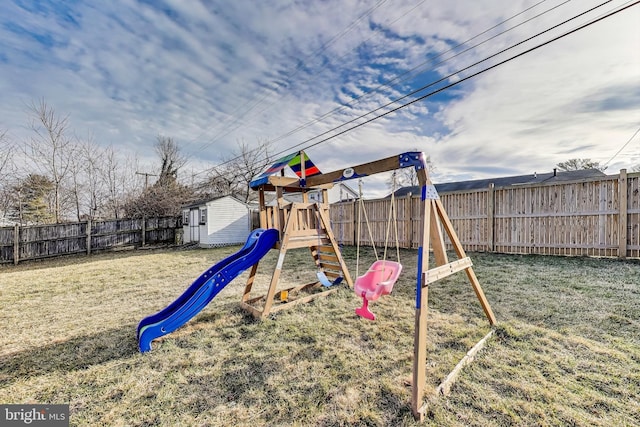 view of play area with a yard and a fenced backyard