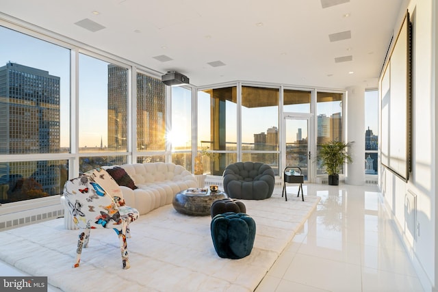 sunroom featuring a city view