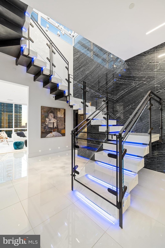 stairs featuring tile patterned flooring