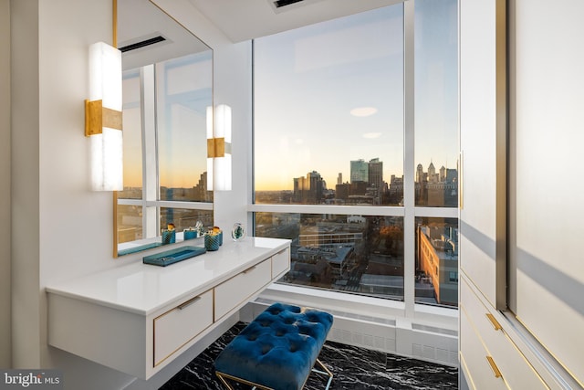 bathroom featuring a view of city and marble finish floor