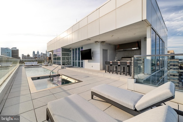 view of patio / terrace with outdoor dry bar and an outdoor hangout area