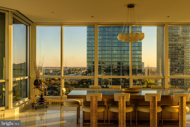 sunroom featuring a healthy amount of sunlight and a city view