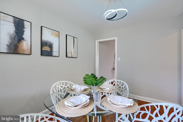 dining area featuring baseboards