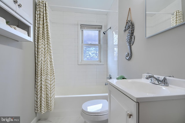 full bath featuring toilet, shower / bath combo, and vanity