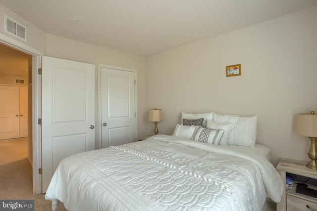 bedroom featuring carpet and visible vents