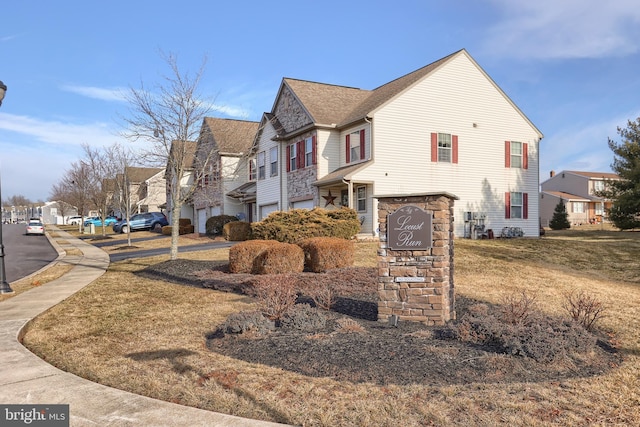 view of side of home with a residential view