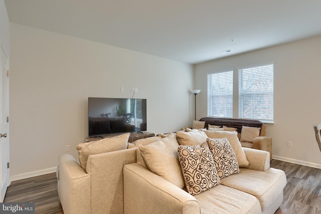 living room with dark wood-style floors and baseboards