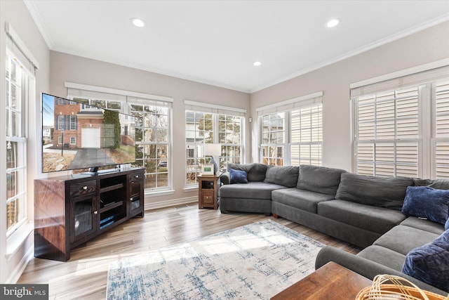 living room featuring recessed lighting, light wood-style flooring, and crown molding