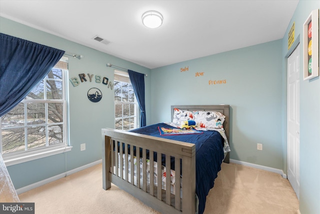 bedroom featuring baseboards, visible vents, and carpet floors