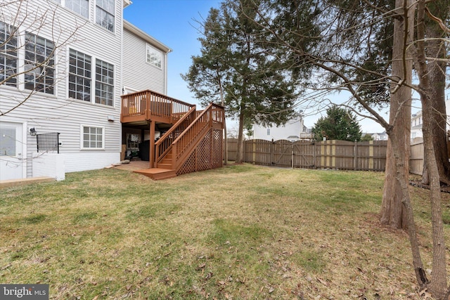 view of yard featuring a gate, stairway, a deck, and fence