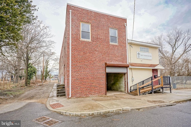 exterior space featuring brick siding