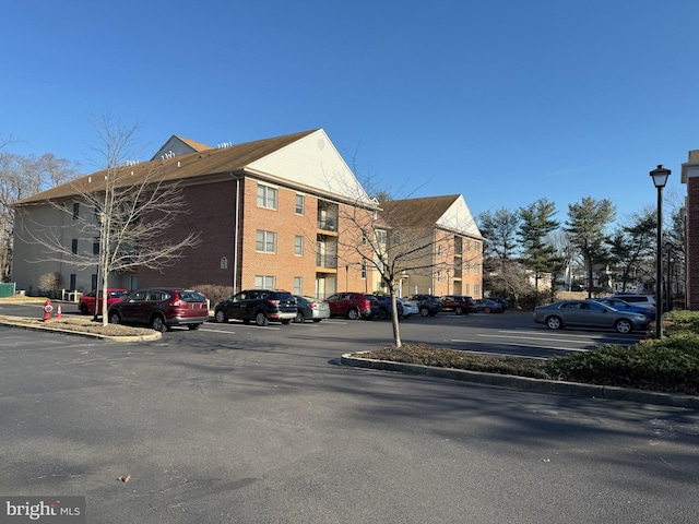 view of property featuring uncovered parking