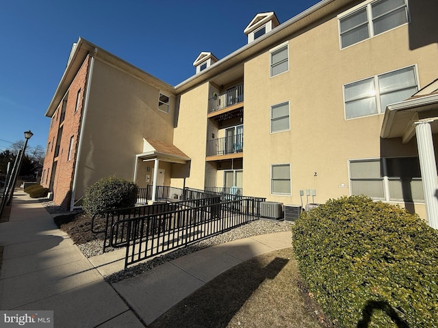 view of property featuring central AC unit