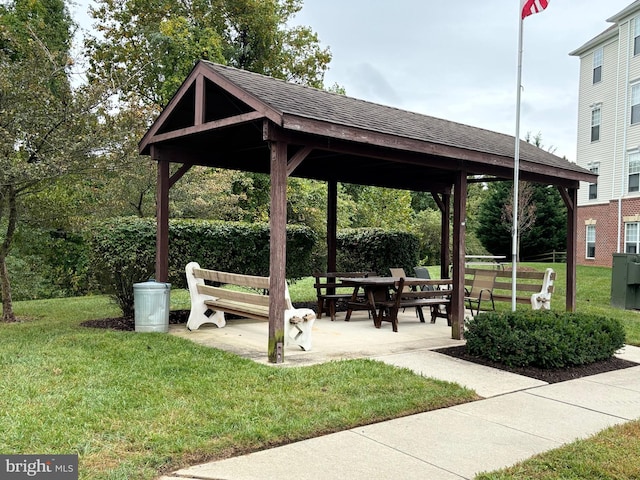 view of home's community with a lawn and a gazebo