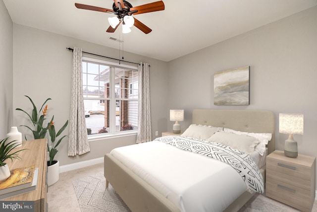 bedroom featuring light carpet, a ceiling fan, and baseboards