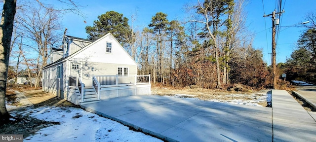 view of side of property with a deck